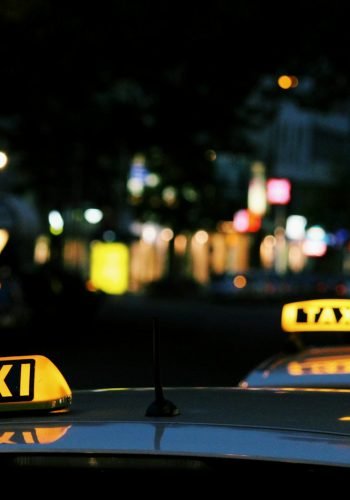 shallow focus photography of Taxi signage